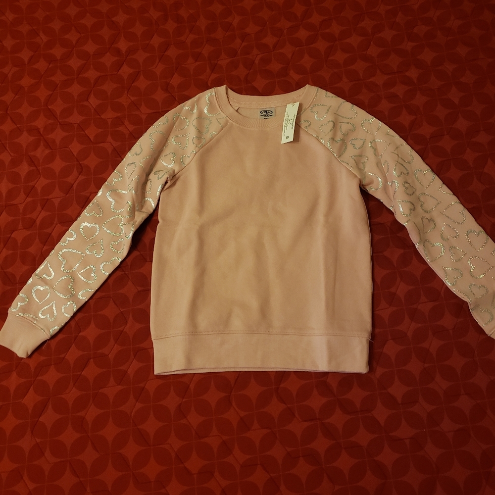 pink sweater with hearts print in sleeves